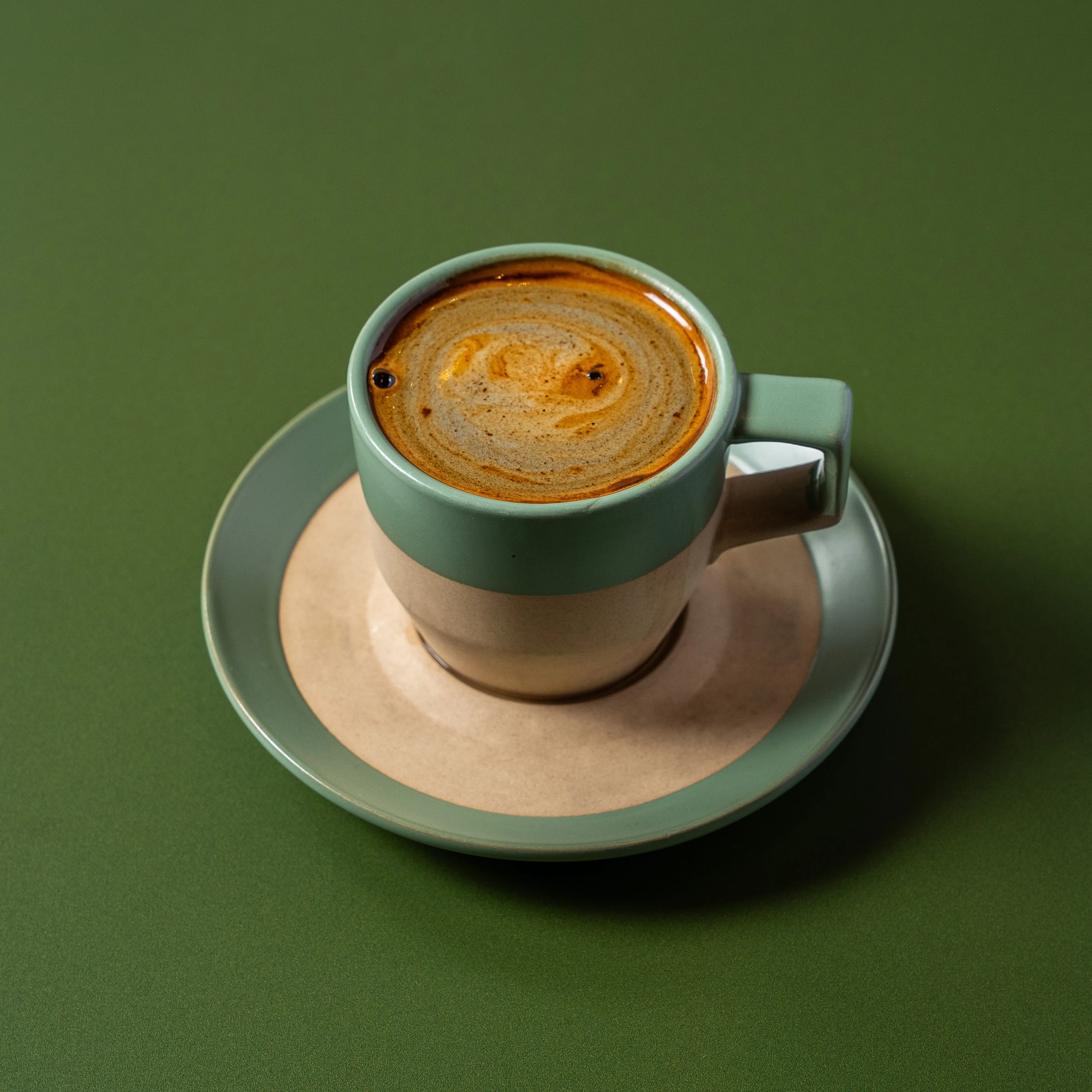 Cappuccino with bold tulip latte art at Madame Olivia
