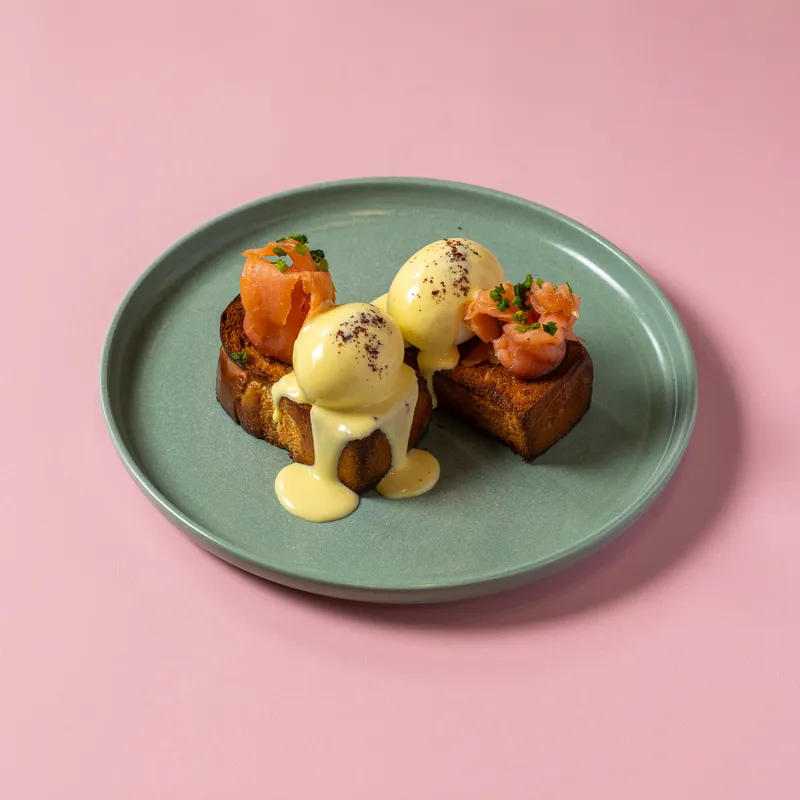 Salmon eggs benedict on sage plate